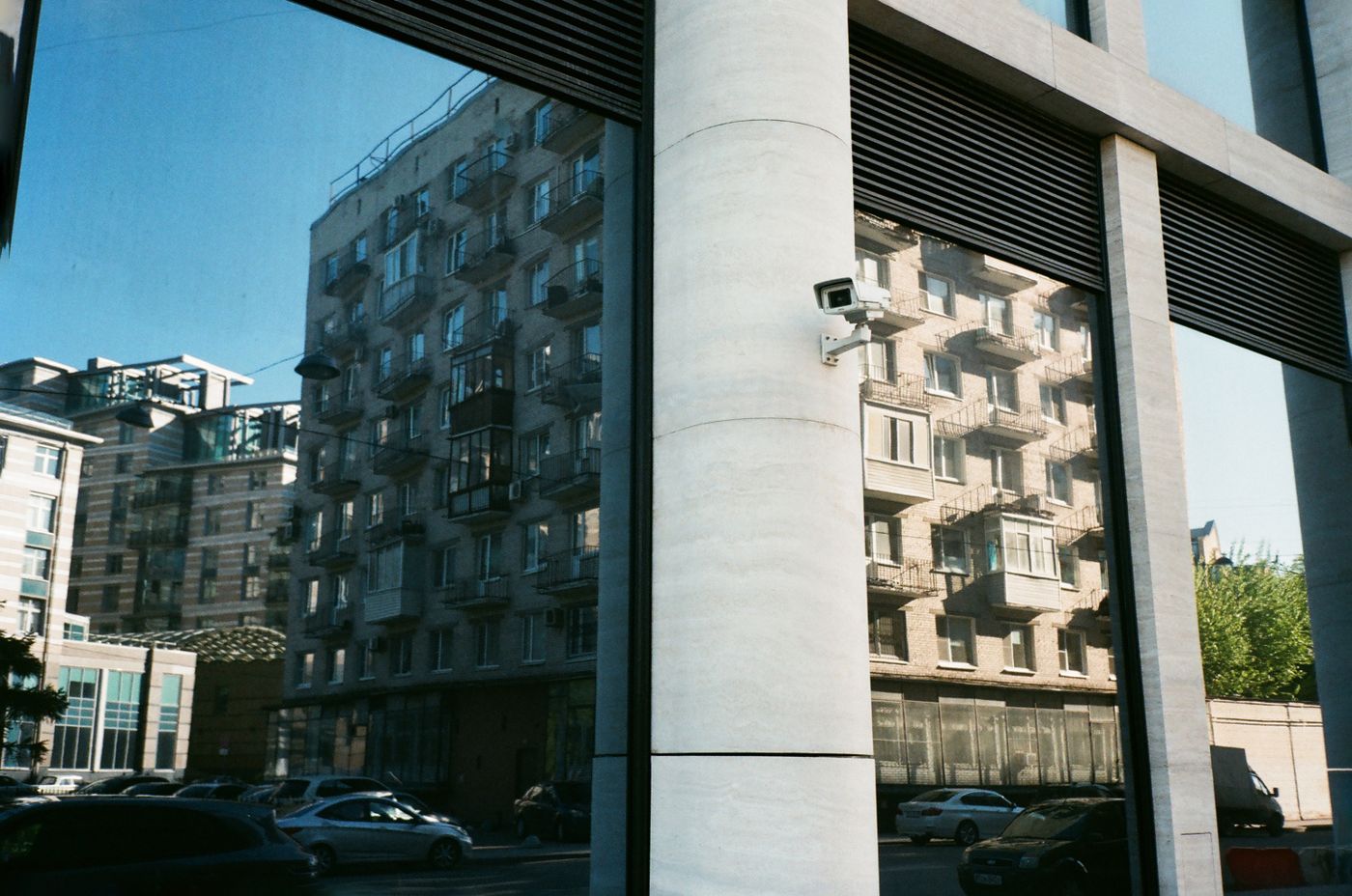 A family home with a small security camera outside